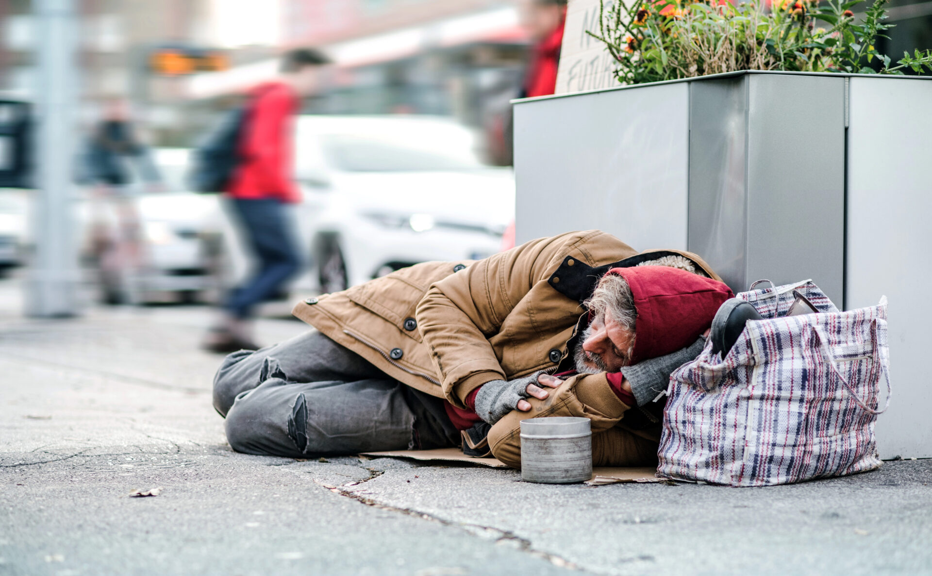 Is homelessness primarily caused by individual choices or systemic issues?